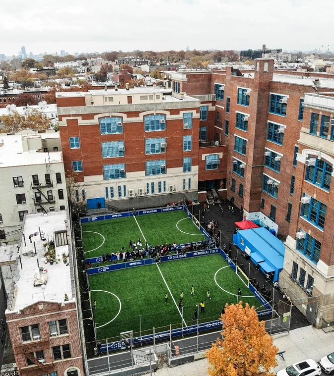 An urban Street Soccer Park surrounded by neighborhood buildings